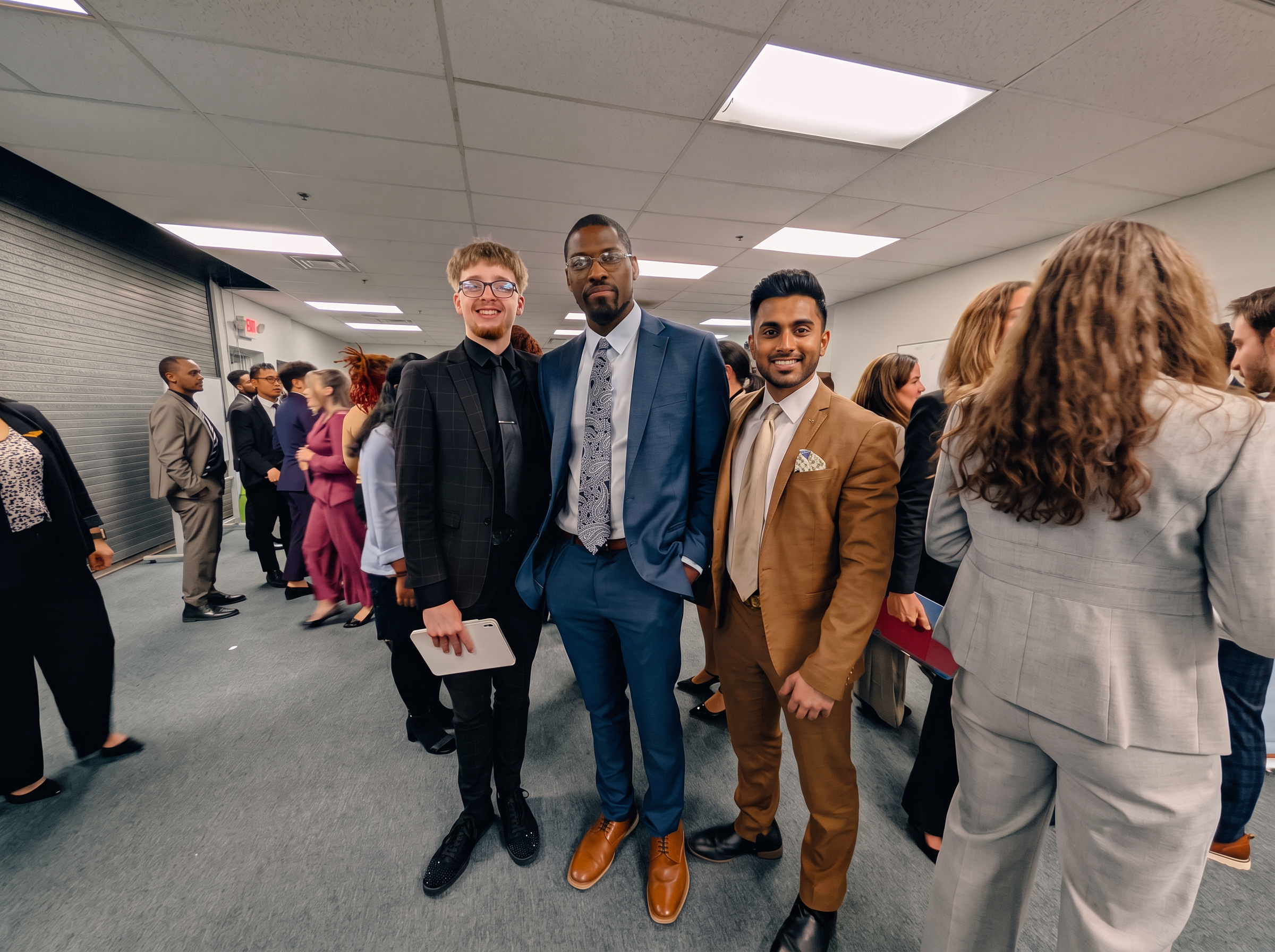 Three teammates in business attire at a Forge Columbus team event